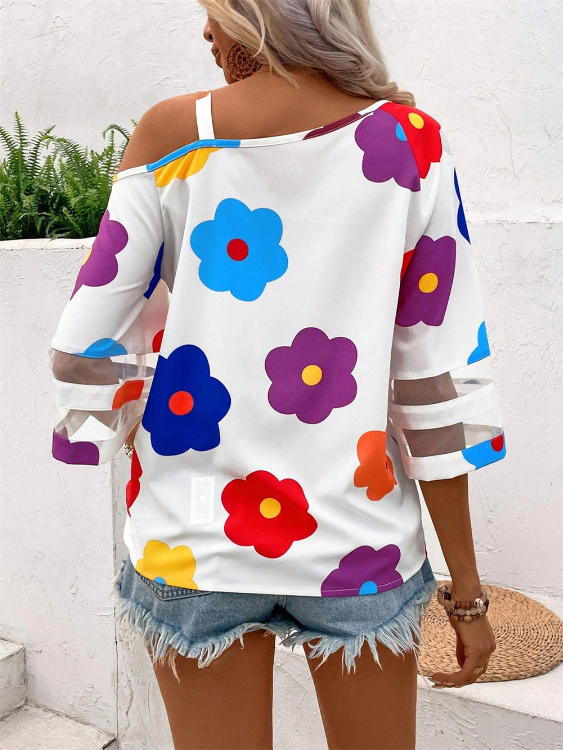 White floral print blouse with cold shoulder and sheer sleeve details
