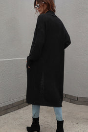 Black textured knit maxi cardigan with pockets and a shawl collar, acrylic material.