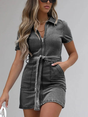 Belted denim shirtdress in dark gray with short sleeves and zip front, cinched waist with tie.
