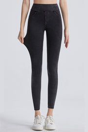 Dark gray denim leggings with faux pockets and a high waist.