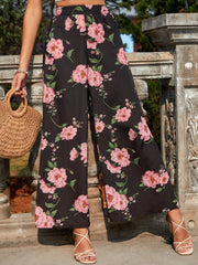 Black palazzo trousers with pink floral print and wide leg, elastic waist