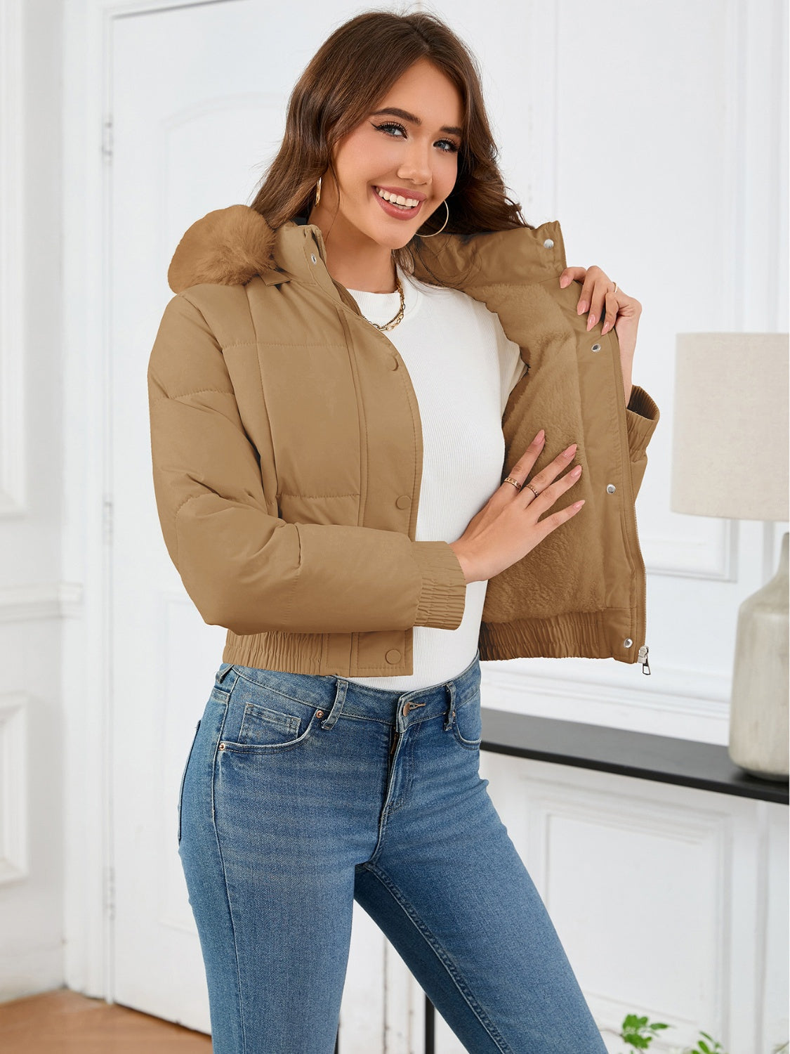 Camel puffer jacket with faux fur trim and elastic cuffs.