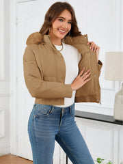 Camel puffer jacket with faux fur trim and elastic cuffs.