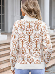 Geometric floral knit turtleneck pullover in white with brown pattern.