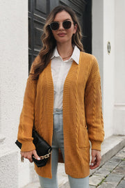 Mustard cable knit longline cardigan with pockets, acrylic, open front, long sleeves.
