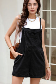 Black denim romper with adjustable straps and cuffed shorts.
