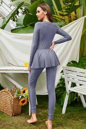 Dark Gray long sleeve swimsuit with flounce hem and full-length leggings.