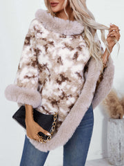 Faux fur trimmed camo poncho in taupe with a relaxed fit and cozy texture.
