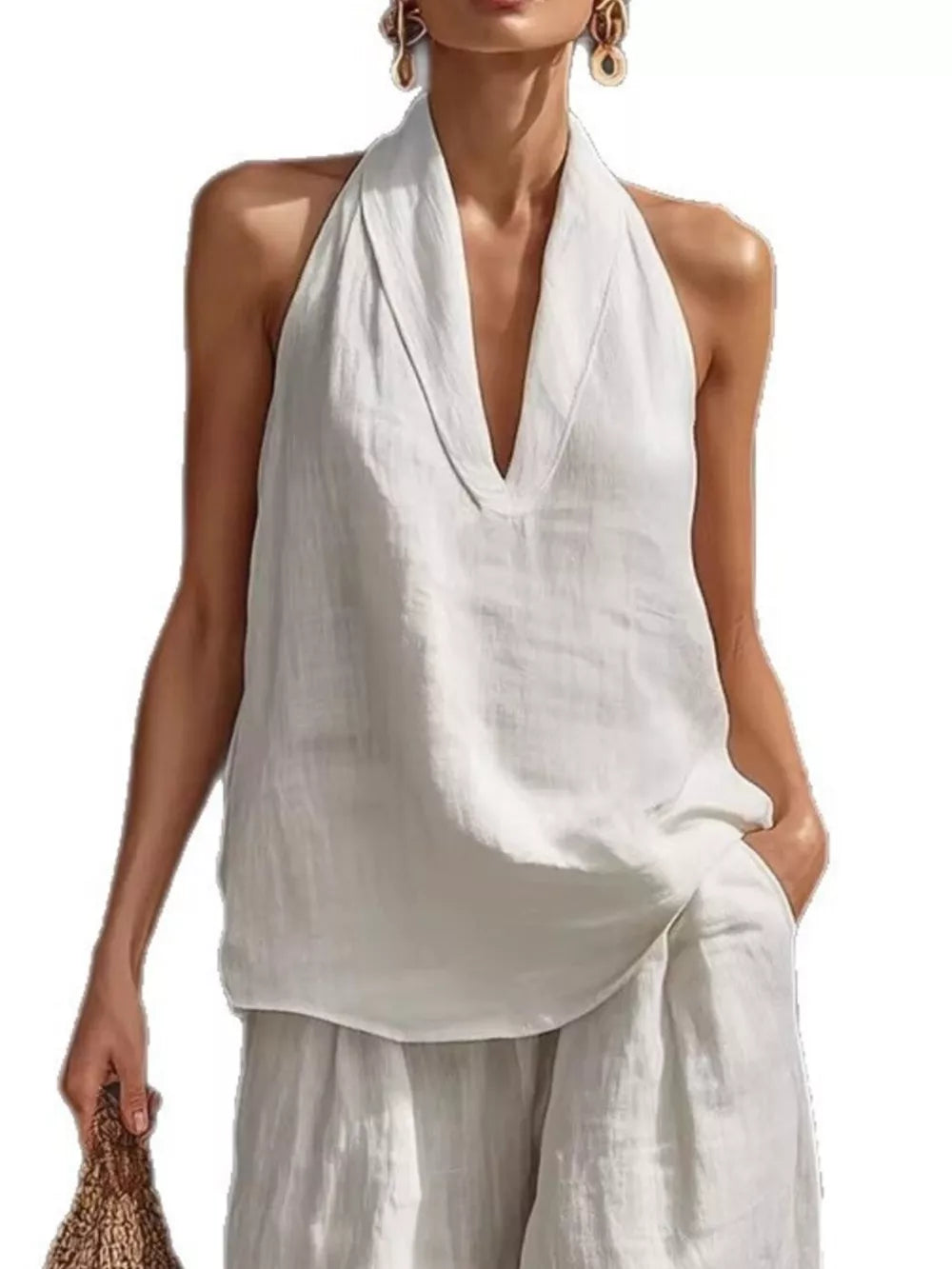 White halter neck top with plunging neckline and flowing wide-leg pants set