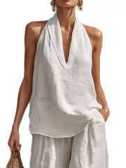 White halter neck top with plunging neckline and flowing wide-leg pants set