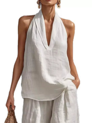 White halter neck top with plunging neckline and flowing wide-leg pants set