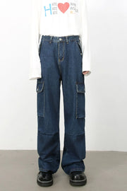 Denim palazzo cargo pants in dark wash with multiple pockets and a baggy fit.