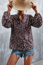 Brown abstract heart print pussy bow blouse with balloon sleeves.