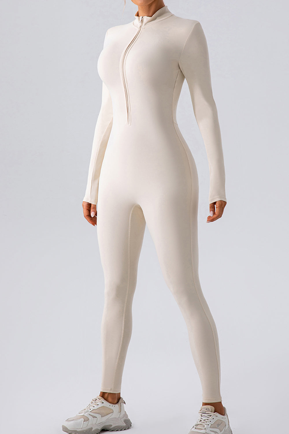 White zip-front bodycon jumpsuit with long sleeves and mock neck
