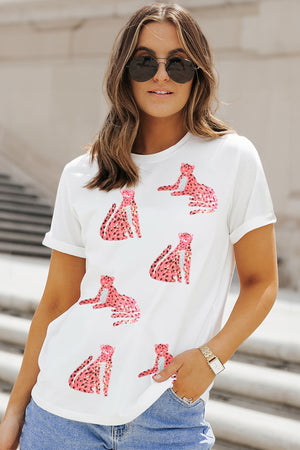 White t-shirt with all-over pink sequin leopard print, crew neck, short sleeves.