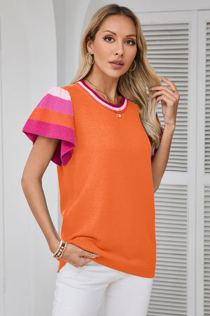 Orange knit blouse with flutter sleeves and colorblock trim