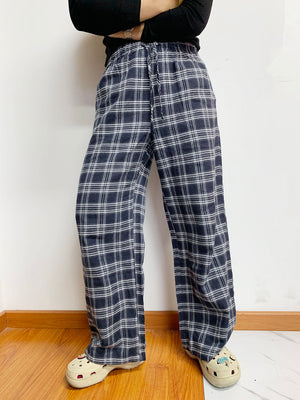 Relaxed plaid drawstring palazzo pants in dusty blue with a wide leg and checkered pattern.