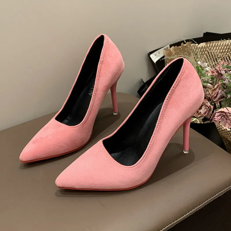 Pink suede pointed stiletto pumps with crimson soles