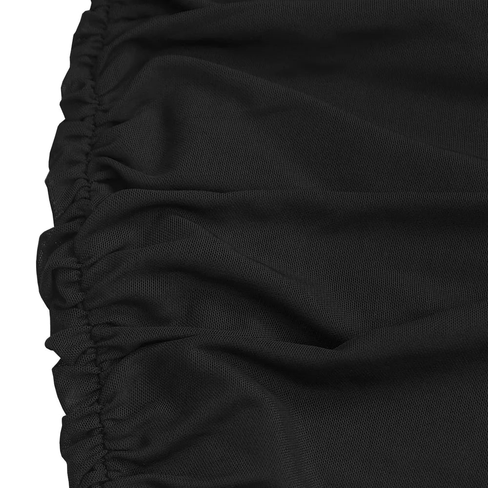 Black ruched bodycon maxi dress detail showing textured fabric and ruching.