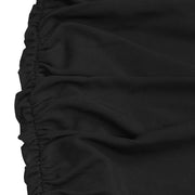 Black ruched bodycon maxi dress detail showing textured fabric and ruching.