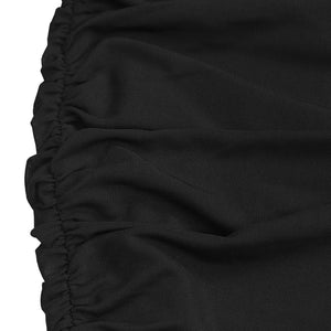 Black ruched bodycon maxi dress detail showing textured fabric and ruching.