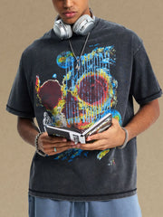 Black acid wash graphic t-shirt with abstract art print.
