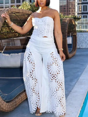 White lace cutout tube top and wide-leg pants set with airy eyelet details.