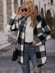 Checked plaid teddy coat with oversized collar in black and white, featuring a zip front and soft fuzzy texture.