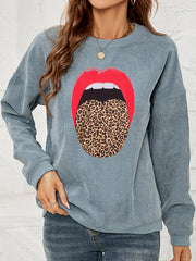 Corduroy crewneck sweatshirt in Deep Teal with a red lip and leopard tongue graphic.