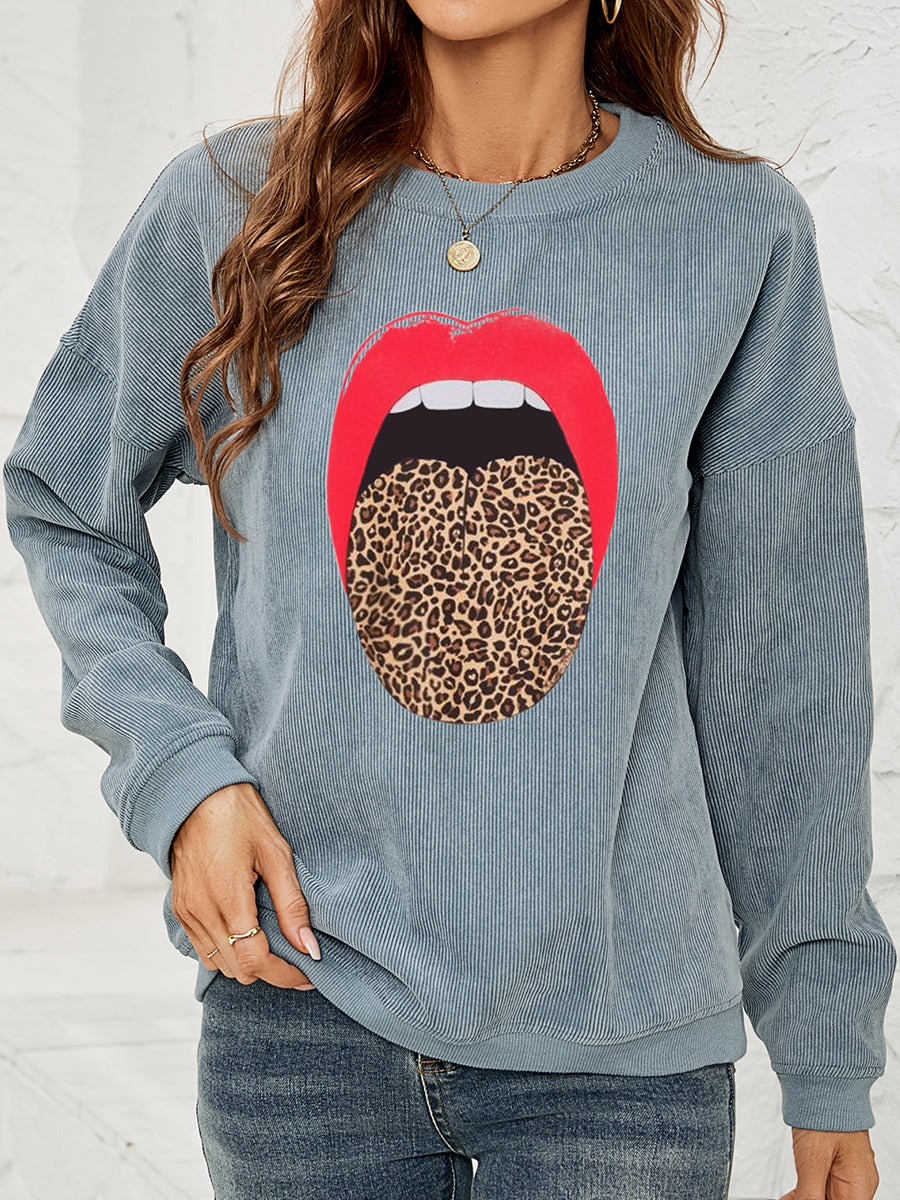 Corduroy crewneck sweatshirt in Deep Teal with a red lip and leopard tongue graphic.