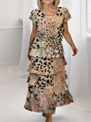 Ruffled tiered maxi dress in multicolor with short sleeves and a floral print.