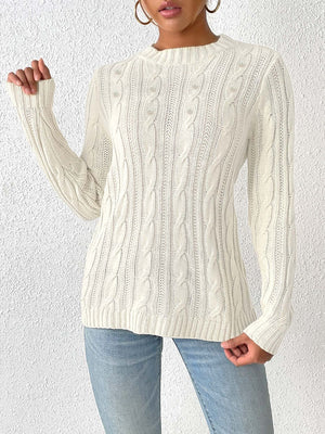 Ivory cable knit sweater with pearl embellishments and crew neck.