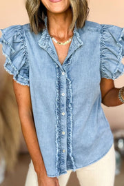 Light blue denim button-up shirt with frayed ruffle trim on sleeves and placket.