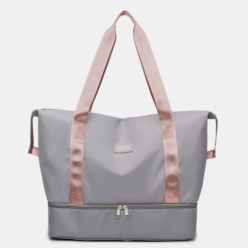 Gray dual-compartment travel tote with pink straps and metallic trim
