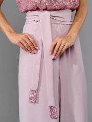 Dusty pink palazzo pants with sequin-trimmed tie belt and matching sequin bodice.
