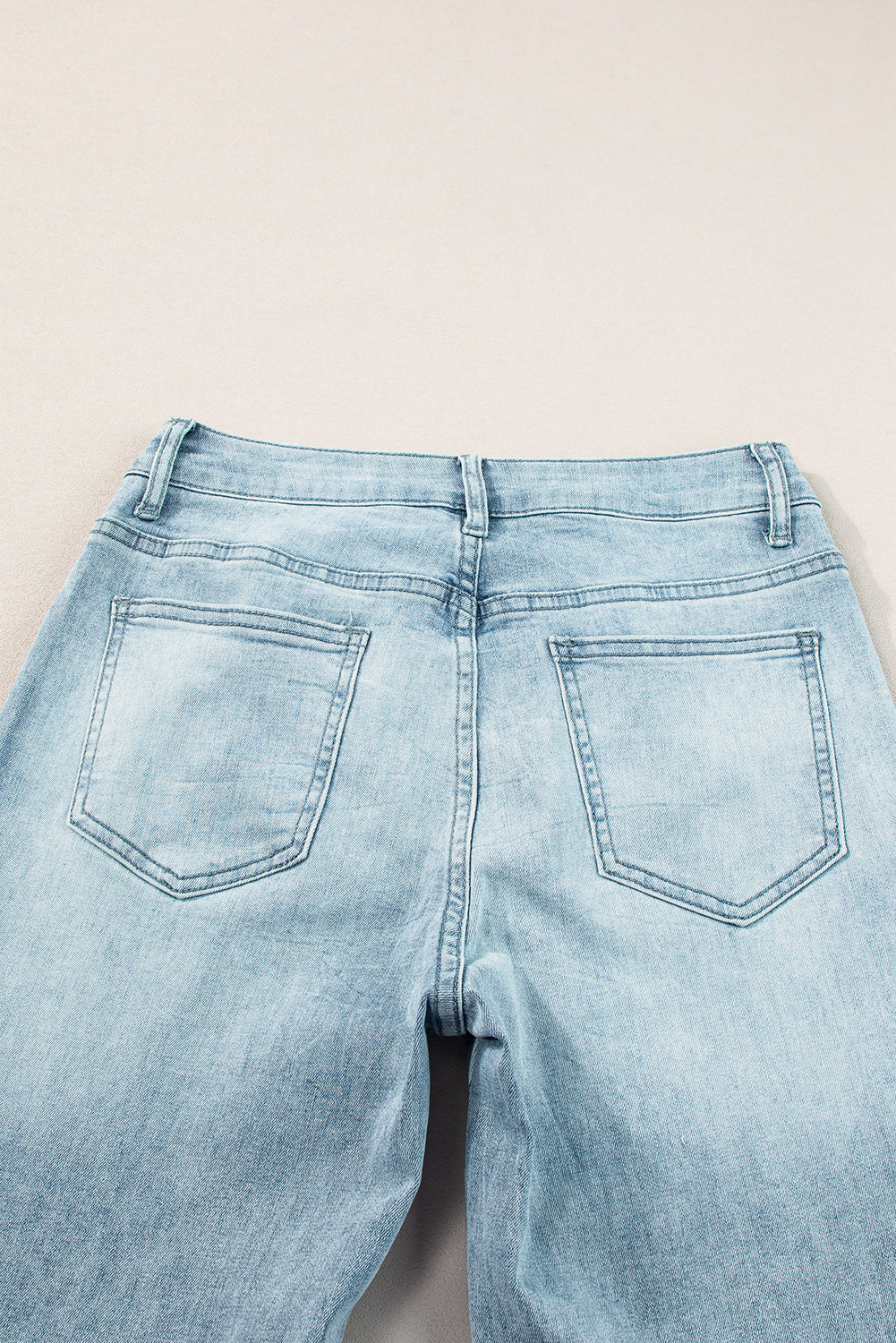 High-waisted palazzo flare denim jeans in medium wash with back pockets