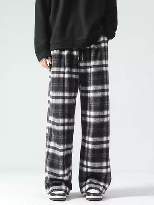 Black and white plaid wide-leg sweatpants with drawstring waist.