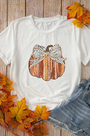 White t-shirt with striped pumpkin graphic and spotted bow detail