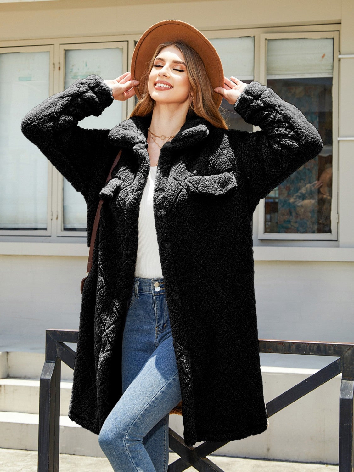 Black quilted teddy bear coat with patch pockets and button front.