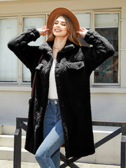 Black quilted teddy bear coat with patch pockets and button front.