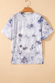 Crew neck t-shirt with a faded camouflage leaf print in purple and blue tones.