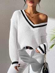 White ribbed knit sweater with varsity stripe V-neck and cuffs, styled off-shoulder.