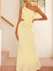 Yellow one-shoulder maxi dress with floral appliqué and cutout detail.