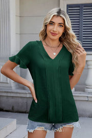 Dark green textured blouse with V-neck, pleat front, and flutter sleeves.