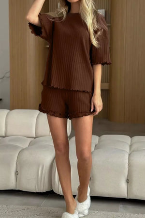 Brown ribbed knit pajama set with ruffled trim on short sleeves and shorts.