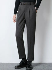 Men's dark gray pleated dress pants with cuffed hems and a double button closure.