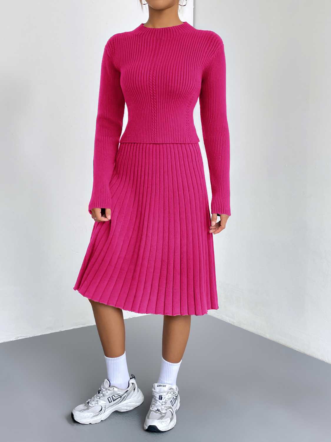 Hot Pink ribbed knit fit-and-flare co-ord with a mock neck and pleated skirt.