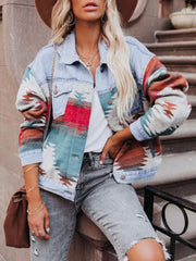Light blue denim jacket with Aztec pattern patchwork and button closure.