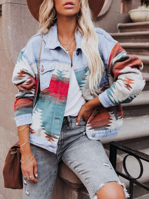 Light blue denim jacket with Aztec pattern patchwork and button closure.