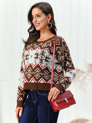 Geometric snowflake knit sweater in chestnut brown acrylic with crew neck and long sleeves.
